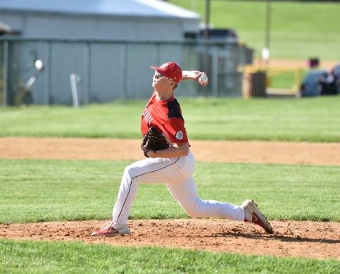 Senior Ashton Wetzler throws out a  pitch.