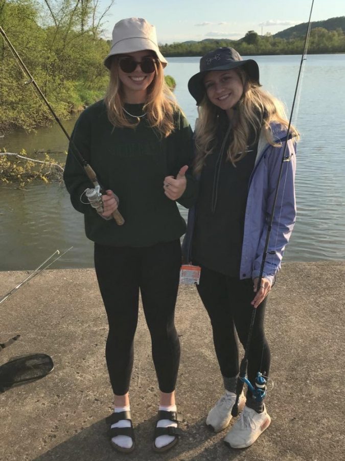 Senior Shea Kelley and Lily Wichert try their hand out at fishing. 
