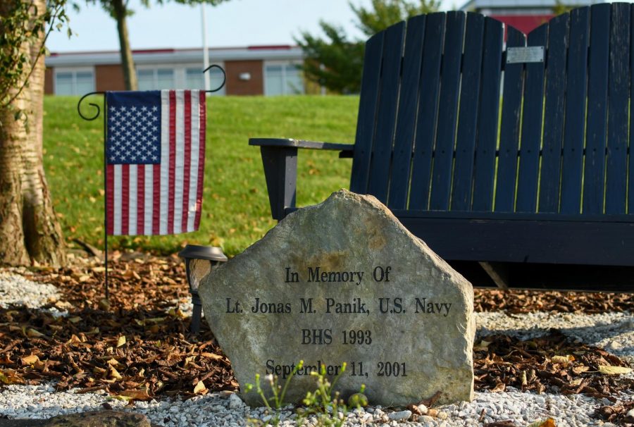A memorial rock sits in front of the school to honor Lt. Jonas M. Panik. 