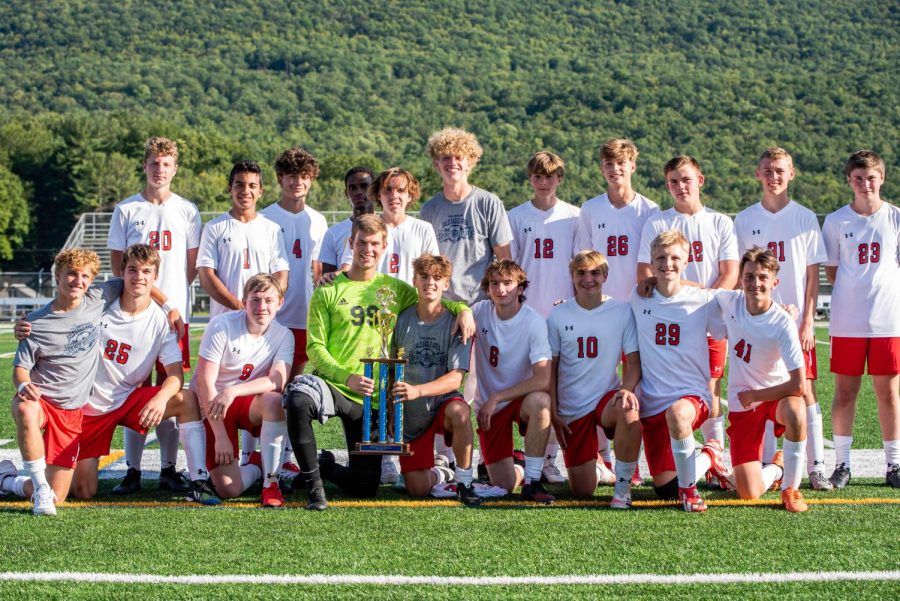 The boys soccer team comes together at the end of a victorious tournament at Bald Eagle. 