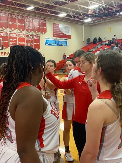 Kaley Everhart on the sideline during a game. Everhart was brought on to coach J.V girls basketball this month.