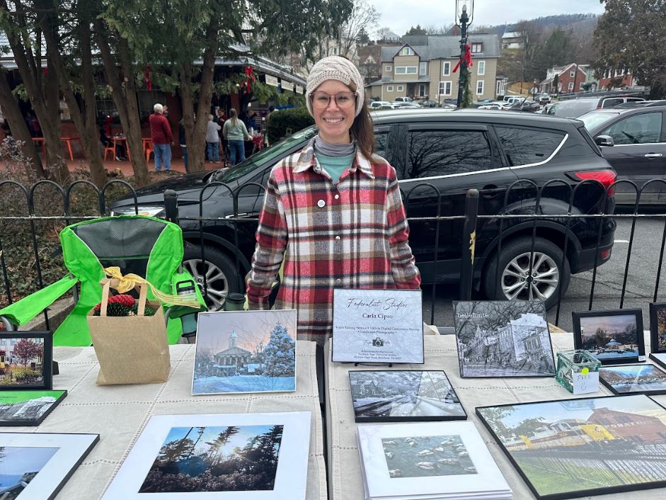 Mrs. Cipro sells her photography during Bellefontes Victorian Christmas weekend. 