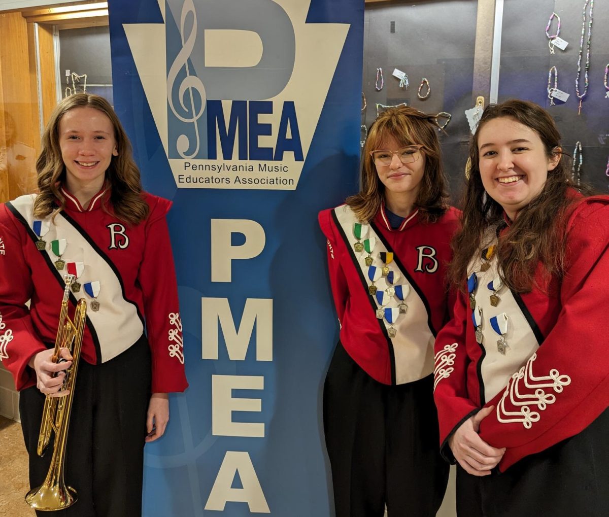 Students who qualified for Regional Band from left: Baily Hoff, Emma Liadis, and Sophia Harper. 