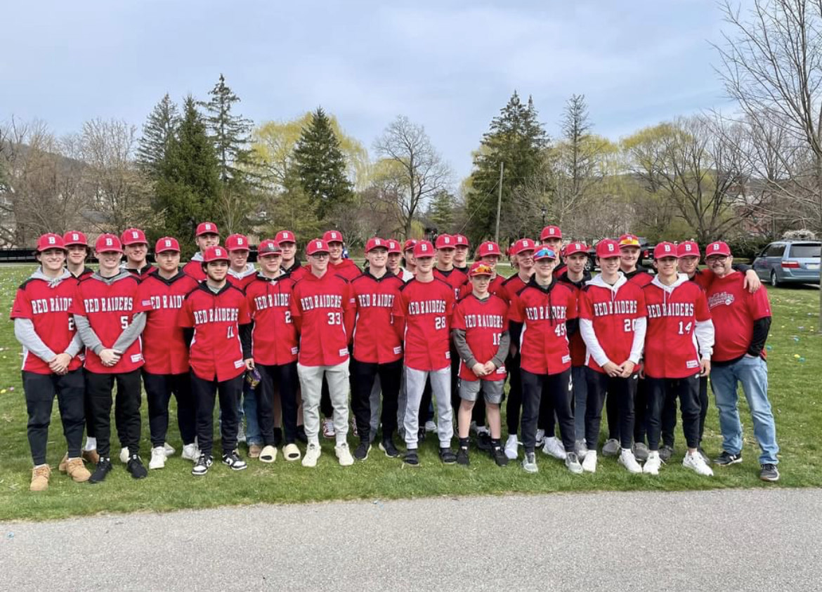 The baseball team poses after helping with the egg hunt at Talleyrand Park. 