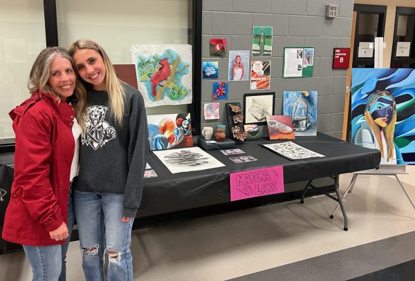 Senior Makena Lake with her mom during the Art Show. 