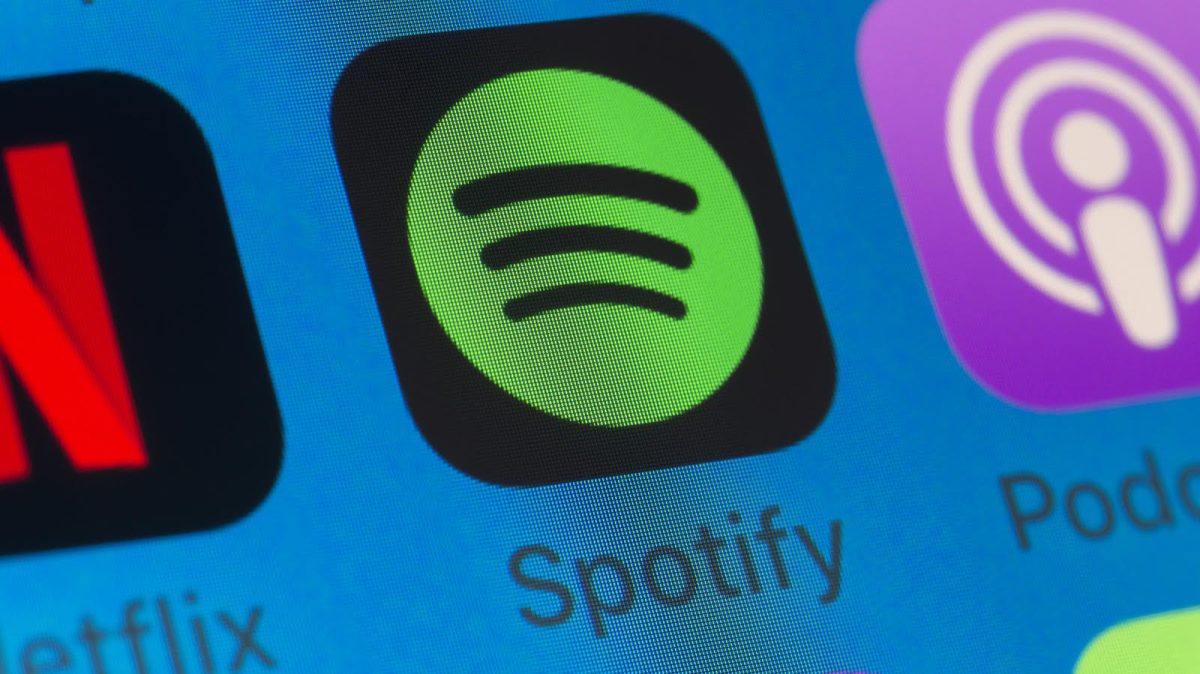 London, UK - August 01, 2018: The buttons of Spotify, Podcasts, Netflix, WhatsApp and Music on the screen of an iPhone.